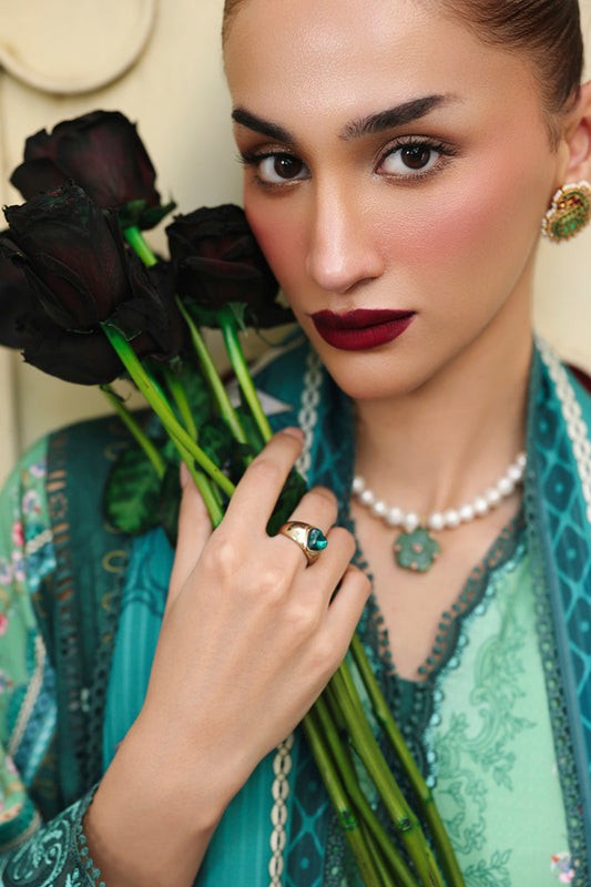 Qalamkar suit in authentic Pakistani palette for seasonal collections