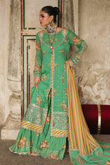Traditional green and gold outfit with intricate patterns, worn by a person indoors.