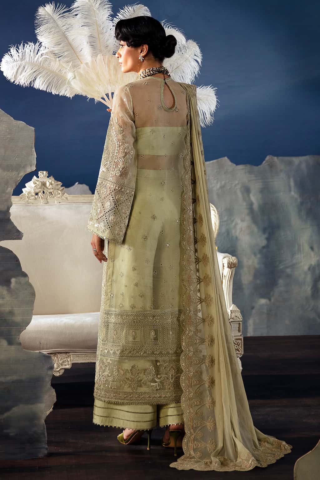 Woman in a traditional outfit with a decorative background