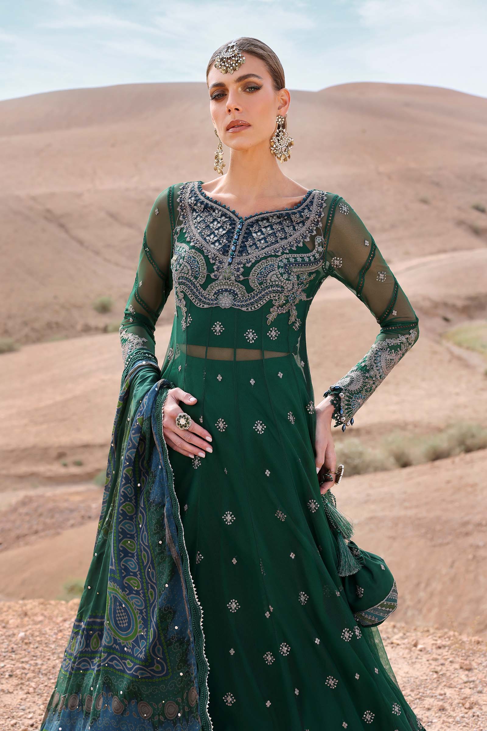 Maria B Luxury Lawn 2025 – unstitched embroidered suit with printed dupatta and cambric trousers, ideal for festive and formal wear.