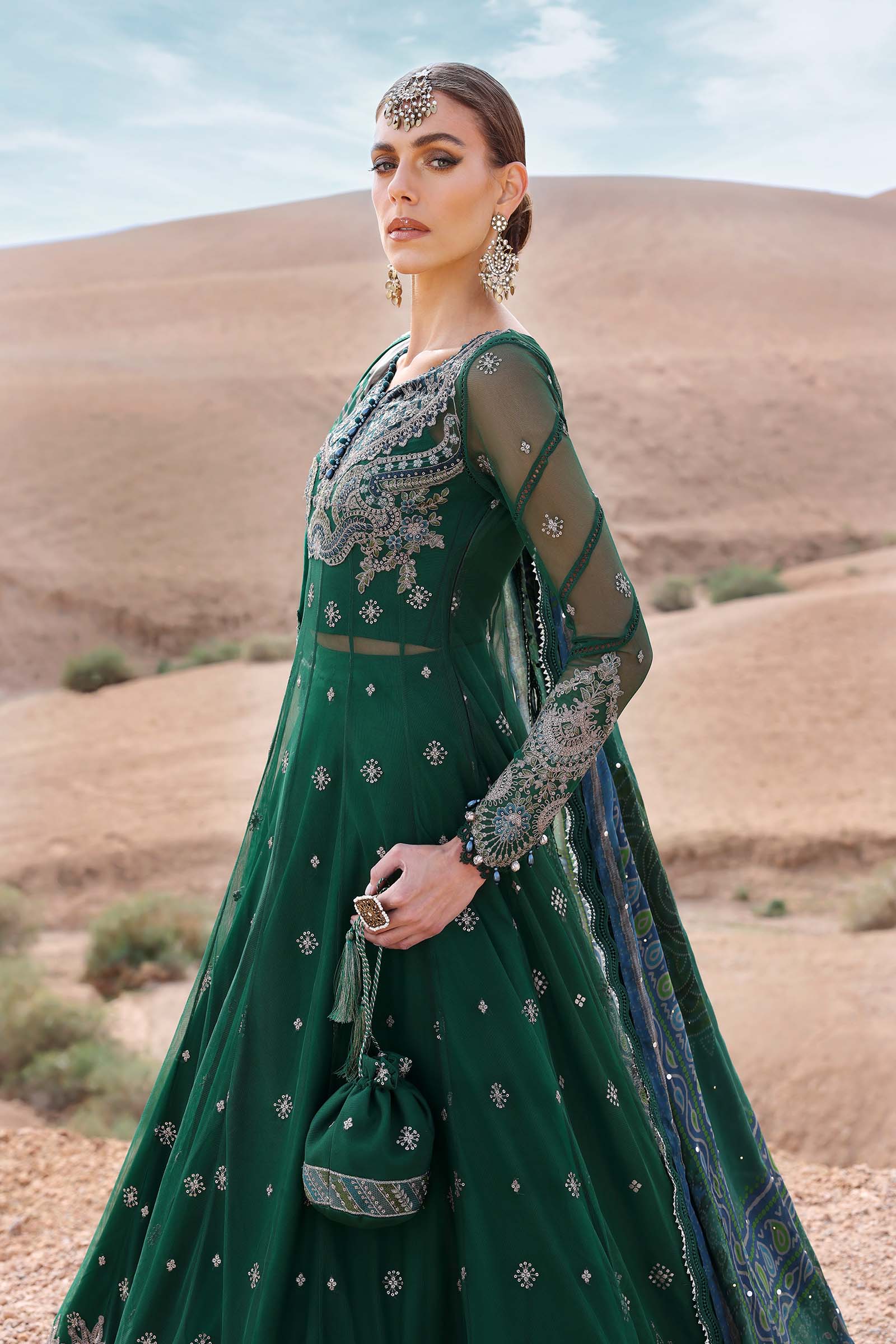 Maria B Luxury Lawn 2025 – unstitched embroidered suit with printed dupatta and cambric trousers, ideal for festive and formal wear.